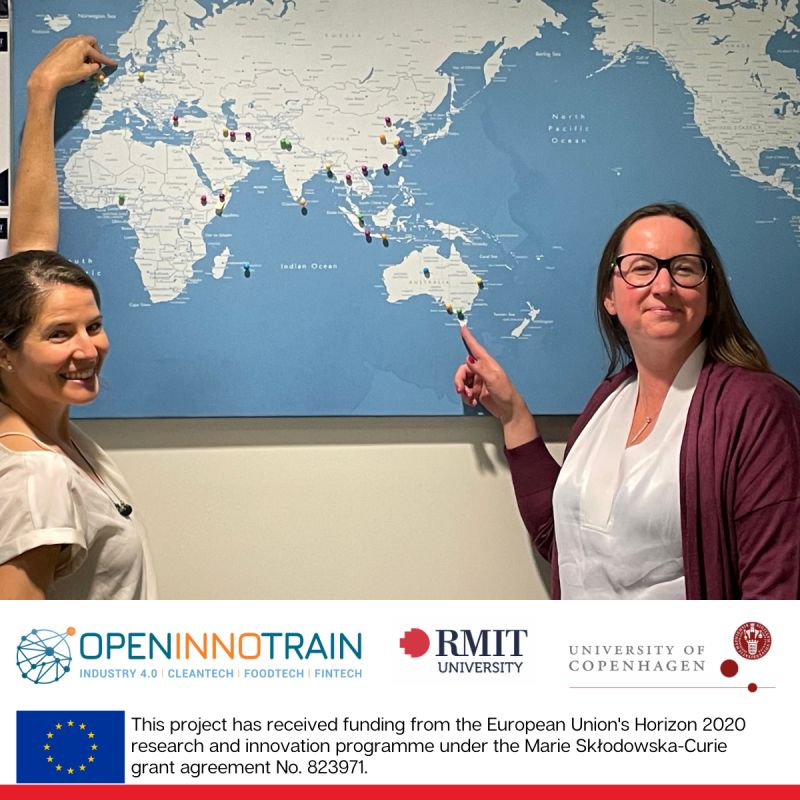 Mar Moure Peña and Anne-Laure Mention standing in front of a map of the world to show the connection between Europe and Australia